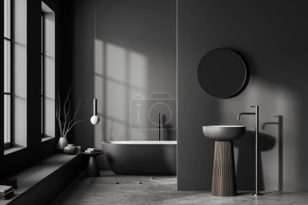 Foto de Dark bathroom interior with sink and bathtub on grey concrete floor. Modern bathing area with partition and panoramic window. 3D rendering - Imagen libre de derechos