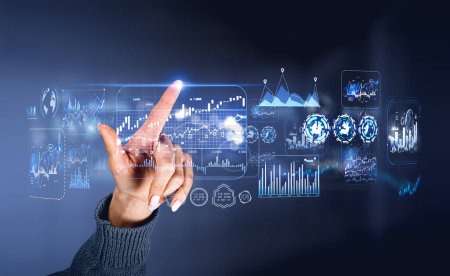 Foto de Woman finger touching virtual screen with forex diagrams and graphs. Digital financial data analysis and global statistics. Concept of investment - Imagen libre de derechos