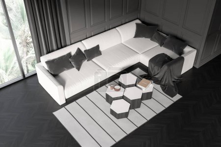 Téléchargez les photos : Top view on dark living room interior with large sofa, coffee table, panoramic window, crockery, books, grey wall, hardwood floor. Concept of minimalist design. Place for meeting. 3d rendering - en image libre de droit