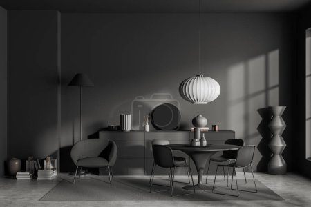 Téléchargez les photos : Dark living room interior with round table and chairs, armchair with lamp on carpet on grey concrete floor. Relaxing area and sideboard with minimalist decor. 3D rendering - en image libre de droit