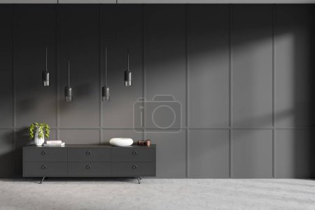 Téléchargez les photos : Dark empty room interior with empty grey wall, sideboard with books and crockery, concrete floor. Concept of spacious place made for creative idea. 3d rendering - en image libre de droit