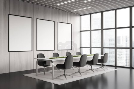 Téléchargez les photos : Light grey conference room interior with armchairs and board, side view. Meeting corner with panoramic window on skyscrapers. Three mockup posters. 3D rendering - en image libre de droit