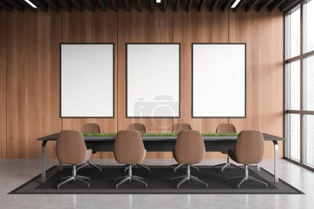 Téléchargez les photos : Wooden meeting room interior with armchairs and board, carpet on grey concrete floor. Conference room with panoramic window. Three mockup posters. 3D rendering - en image libre de droit