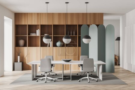 Téléchargez les photos : Modern office interior with armchairs and desk on carpet, hardwood floor. Wooden shelf with books and vase. Room divider and lamps. 3D rendering - en image libre de droit