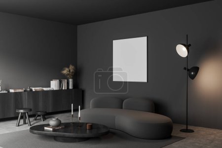 Photo for Dark living room interior with sofa, coffee table and black wooden dresser with decoration, side view carpet on grey concrete floor. Mock up canvas square poster. 3D rendering - Royalty Free Image