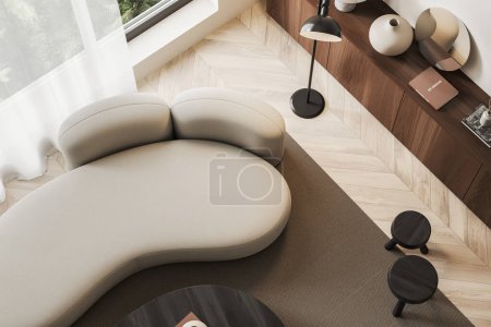Photo for Top view of beige living room interior with sofa, carpet on hardwood floor. Stylish wooden dresser with art decoration and panoramic window. 3D rendering - Royalty Free Image