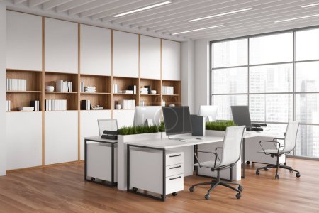 Téléchargez les photos : White coworking interior with armchairs and pc computer on desk, side view hardwood floor. Office corner with shelf and panoramic window on city view. 3D rendering - en image libre de droit
