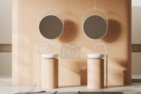 Téléchargez les photos : Stylish bathroom interior with double sink and two round mirrors, mixer mounted on light concrete floor. Minimalist bathing area with beige tile wall. 3D rendering - en image libre de droit