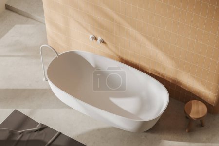 Téléchargez les photos : Top view of beige bathroom interior with bathtub and carpet on light concrete floor. Stylish bathing corner in hotel studio. 3D rendering - en image libre de droit