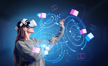 Foto de Smiling woman profile in vr glasses hands touching colorful blocks, glowing earth sphere and global connection. Concept of information fields - Imagen libre de derechos