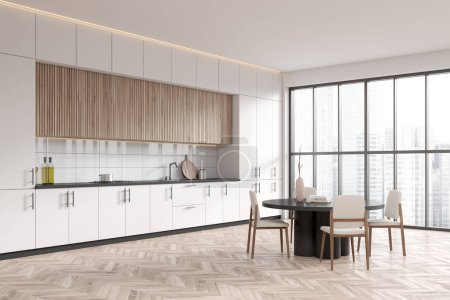 Téléchargez les photos : Light kitchen interior with dining table and chairs, side view hardwood floor. Cooking corner with shelves and kitchenware, panoramic window on skyscrapers. 3D rendering - en image libre de droit