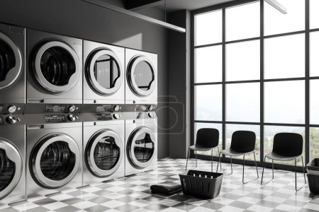 Photo for Dark laundry interior with grey washing machines in row, side view waiting corner with chairs on chess tile floor. Panoramic window on countryside. 3D rendering - Royalty Free Image