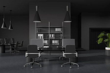 Photo for Dark coworking interior with pc desktop on table and armchairs on grey concrete floor. Business workplace with shelf and documents. 3D rendering - Royalty Free Image