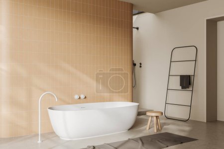 Photo for Beige bathroom interior with bathtub and carpet on light concrete floor. Bathing corner with stool and towel rail ladder. Copy space tile wall. 3D rendering - Royalty Free Image