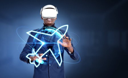 Foto de African businessman in vr glasses, hands touching airplane hud hologram. Virtual reality and worldwide business trip. Concept of conference and metaverse - Imagen libre de derechos