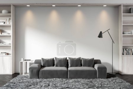 Photo for White living room interior with sofa and wooden shelf with decoration. Soft place with lamp on carpet, black hardwood floor. Mockup copy space empty wall. 3D rendering - Royalty Free Image