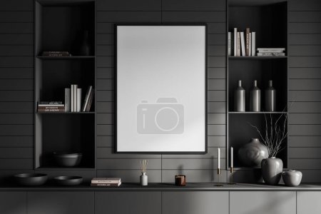 Téléchargez les photos : Front view on dark living room interior with empty white poster, grey wall, cupboard with shelves with books, bottles, candles, vases, crockery. Concept of minimalist design. Mock up. 3d rendering - en image libre de droit