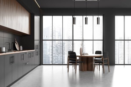Foto de Stylish kitchen interior with dining table and chairs, grey concrete floor. Cooking area with shelves and kitchenware, panoramic window on skyscrapers. 3D rendering - Imagen libre de derechos