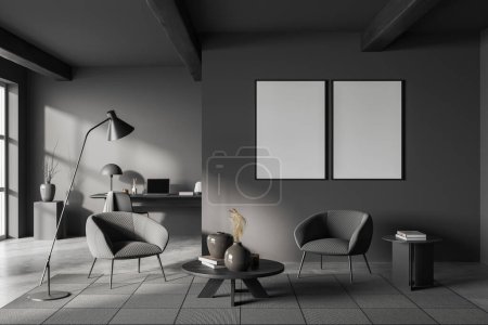 Photo for Dark home office room interior with relax zone, laptop computer on work desk, front view. Window and coffee table on grey concrete floor. Two mockup posters. 3D rendering - Royalty Free Image