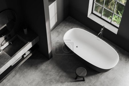 Téléchargez les photos : Top view of dark bathroom interior with sink and tub near window. Bathing corner with bathtub and washbasin with accessories. 3D rendering - en image libre de droit