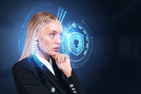 Foto de Thoughtful businesswoman with hand on chin, side view hologram hud with shield protection verification lock and binary. Concept of data privacy and technology - Imagen libre de derechos