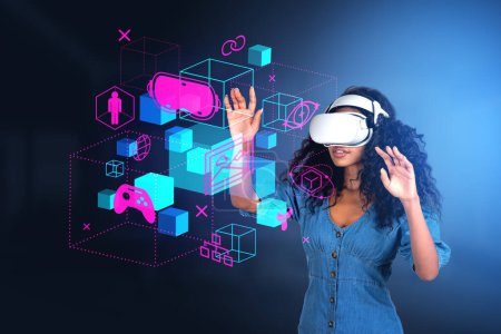 Foto de Black woman in vr glasses finger touch cyberspace hud hologram, diverse digital icons hud. Information fields in virtual reality, game and nft. Concept of futuristic technology - Imagen libre de derechos