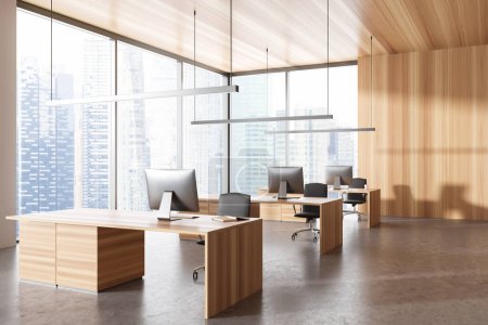 Foto de Wooden office interior with pc desktop on table and armchairs, side view grey concrete floor. Business workplace with panoramic window on city view. 3D rendering - Imagen libre de derechos