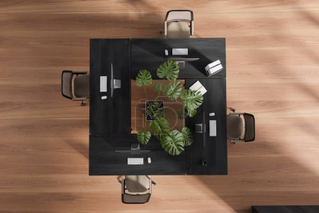 Photo for Top view of coworking interior with pc computer on a shared table, hardwood floor. Minimalist wooden workplace with tools and plant in the center. 3D rendering - Royalty Free Image