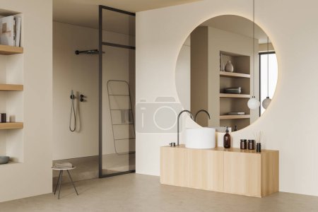 Téléchargez les photos : Beige bathroom interior with sink and round mirror with backlight, side view, light concrete floor. Shelf with decoration and bathing accessories on deck. 3D rendering - en image libre de droit