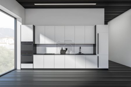 Téléchargez les photos : Intérieur de cuisine noir et blanc avec espace de cuisson, évier et cuisinière. Terrasse avec ustensiles de cuisine et réfrigérateur avec four, parquet foncé. Fenêtre panoramique sur campagne. rendu 3D - en image libre de droit