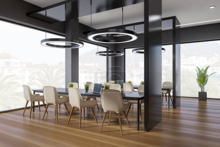 Photo for Corner view on dark office interior with panoramic windows with town view, tables with armchairs, laptops, lamps and hardwood floor. Concept of place for working process. 3d rendering - Royalty Free Image