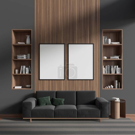 Foto de Front view on dark living room interior with two white empty posters, sofa, coffee table, shelf with books, hardwood floor. Concept of minimalist design. Place for reading. Mock up. 3d rendering - Imagen libre de derechos