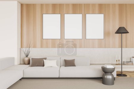 Foto de Cozy living room interior with sofa and shelf with art decoration, carpet on hardwood floor. Three mock up canvas posters on wooden wall. 3D rendering - Imagen libre de derechos