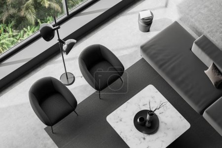 Téléchargez les photos : Top view of dark living room interior with sofa, armchair and coffee table with decoration. Relaxing corner with panoramic window on tropics. 3D rendering - en image libre de droit