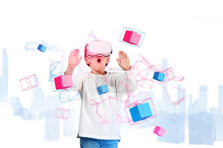 Foto de Excited child boy in vr glasses and open mouth, hands touching metaverse hologram with data blocks and business skyscrapers overlay. Concept of futuristic technology - Imagen libre de derechos