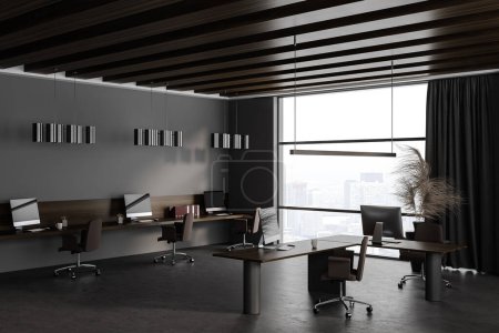 Photo for Dark office interior with coworking and consulting corner, side view grey concrete floor. Modern workspace with pc computers and panoramic window on Paris skyscrapers. 3D rendering - Royalty Free Image