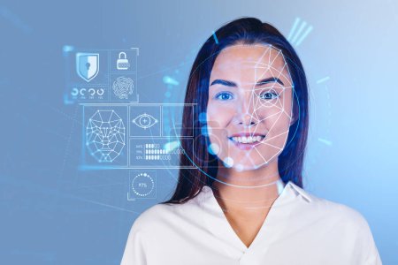 Foto de Smiling businesswoman with digital biometric scanning and data analysis. Face detection and VR interface diagram. Concept of machine learning and security - Imagen libre de derechos