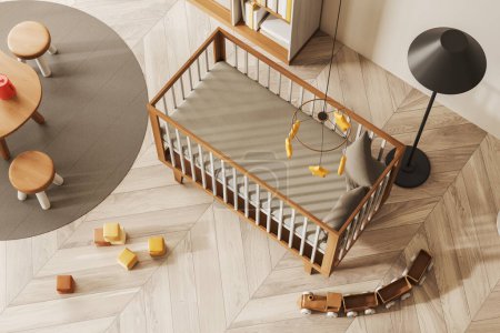 Foto de Top view of light baby room interior with wooden crib, small dining table and stool on carpet with hardwood floor. Nursery corner with toys and decoration. 3D rendering - Imagen libre de derechos
