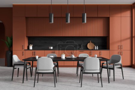 Téléchargez les photos : Front view on dark kitchen room interior with dining table with armchairs, cupboard, ocher wall, concrete floor, gas cooker, shelves with books, sink, desks. Concept of minimalist design. 3d rendering - en image libre de droit