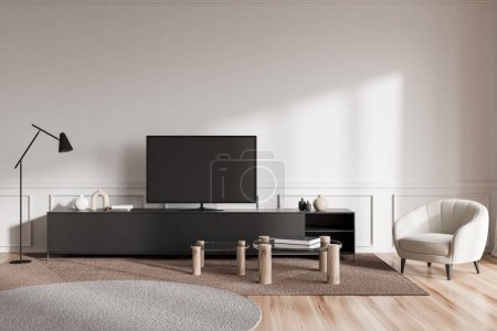 Foto de Luz interior de la sala de estar con televisor en la mesita de noche con decoración, mesa de centro en la alfombra y sillón en el suelo de madera. Elegante zona de salón en apartamento moderno. Renderizado 3D - Imagen libre de derechos