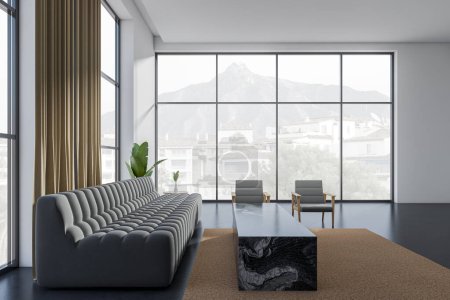 Téléchargez les photos : Salon intérieur moderne avec canapé, vue latérale, deux fauteuils et table basse sur tapis beige, sol en béton foncé. Fenêtre panoramique sur campagne. rendu 3D - en image libre de droit
