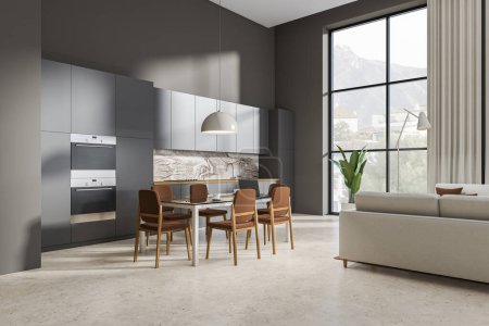Téléchargez les photos : Dark kitchen interior with dining area with chairs on light concrete floor, side view. Chill zone with sofa in hotel studio, panoramic window on countryside. 3D rendering - en image libre de droit