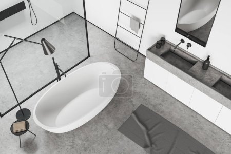 Téléchargez les photos : Top view of White bathroom interior with bathtub, sink and shower behind glass partition, grey concrete floor. Modern hotel studio. 3D rendering - en image libre de droit