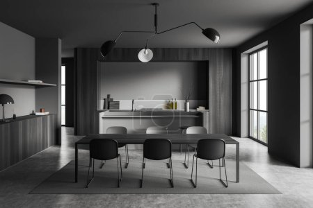 Téléchargez les photos : Dark kitchen interior with dining table, chairs, bar island on grey concrete floor. Eating room with kitchenware and decoration, panoramic window on countryside. 3D rendering - en image libre de droit