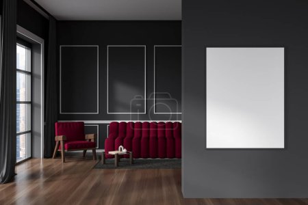 Téléchargez les photos : Intérieur sombre du salon avec canapé et fauteuil sur parquet, table basse et fenêtre panoramique sur la ville de Singapour. Maquette de toile vierge sur mur gris, rendu 3D - en image libre de droit