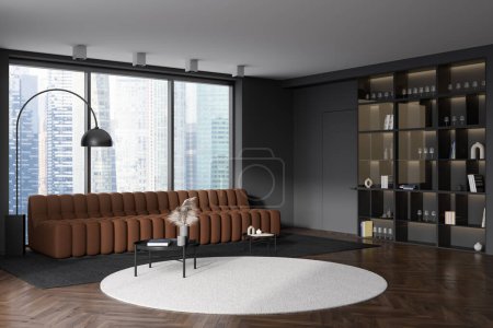 Téléchargez les photos : Dark living room interior with sofa, coffee table on carpet and hardwood floor. Shelf with decoration, side view, panoramic window on Singapore city view. 3D rendering - en image libre de droit