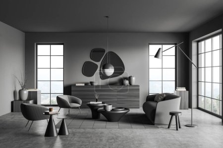 Foto de Interior de la sala de estar oscura con sofá y dos sillones, mesa de centro y cómoda con decoración, alfombra en piso de hormigón gris. Ventana panorámica en el campo. Renderizado 3D - Imagen libre de derechos