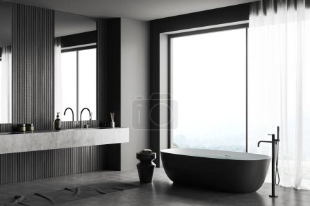 Foto de Interior del cuarto de baño oscuro con doble lavabo y bañera, toalla de pie vista lateral en piso de hormigón gris. Ventana panorámica en el campo. Renderizado 3D - Imagen libre de derechos