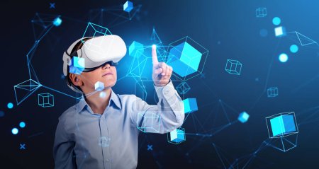Foto de Child boy with vr glasses finger touching digital hologram with data blocks and abstract lines, information fields and blockchain. Concept of metaverse - Imagen libre de derechos