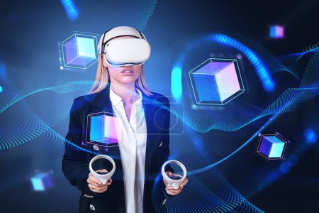 Photo for Businesswoman wearing vr headset is watching at metaverse reality with blockchain system. Dark background. Concept of modern technology, progressive currency in business, ambitious business person - Royalty Free Image
